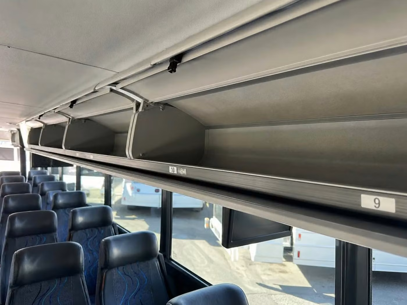 adelanto 28 passenger minibus overhead storage