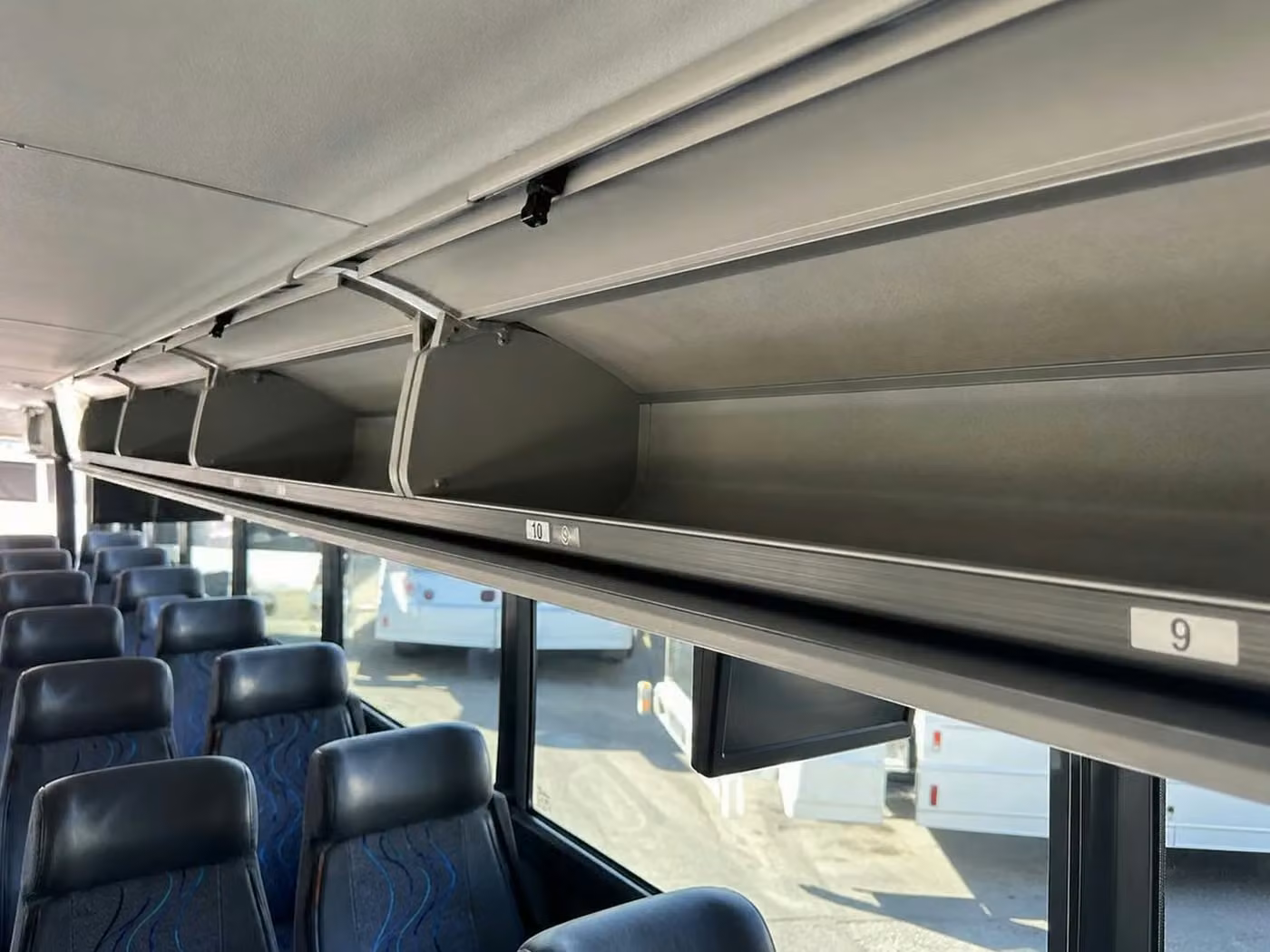 adelanto 56 passenger charter bus overhead storage