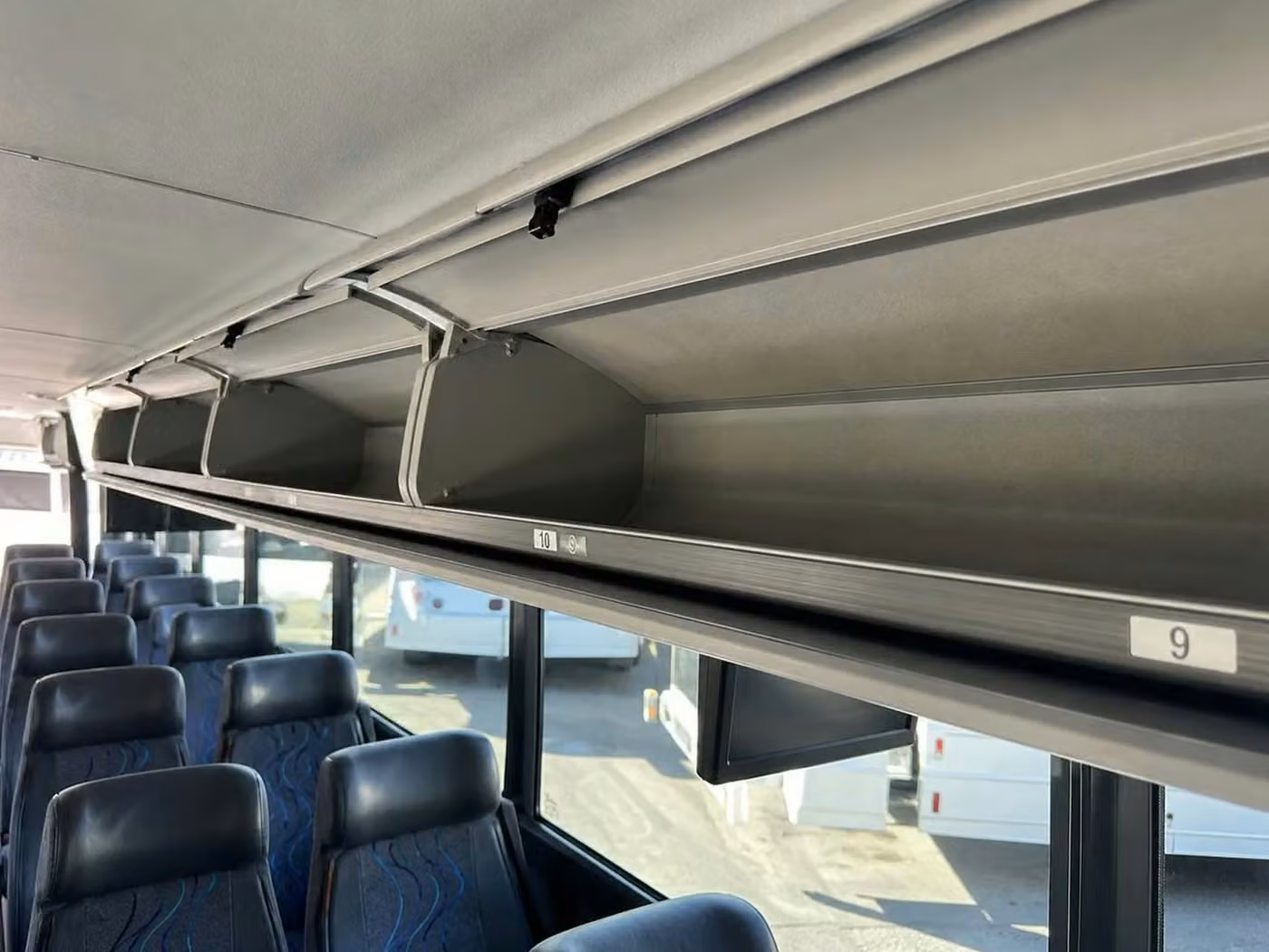 adelanto charter bus overhead storage